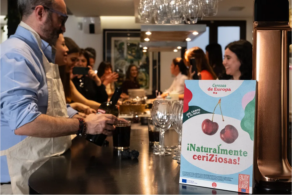 European cherries campaign branding displayed during a promotional event managed by Atlas for an EU-funded agri-food programme.