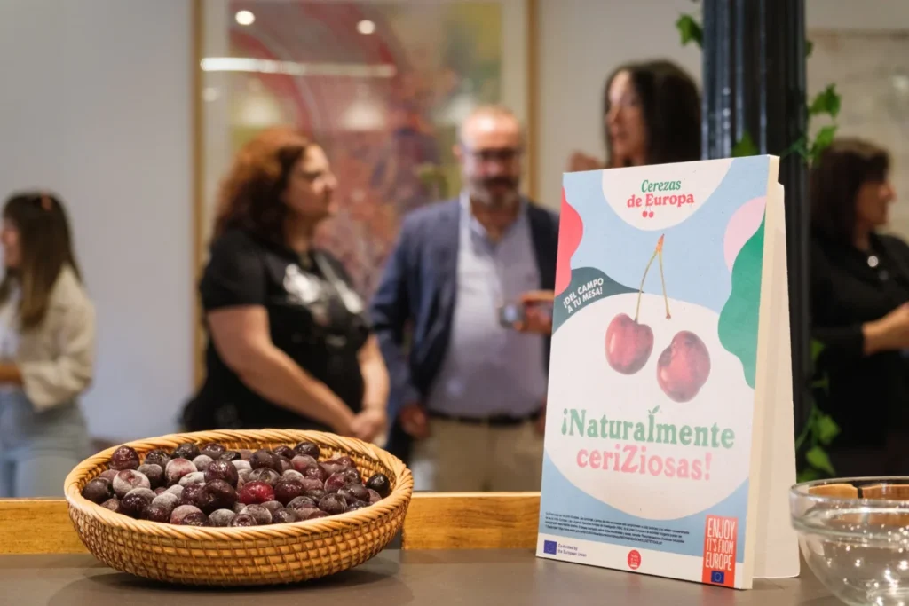 European cherries campaign branding displayed during a promotional event managed by Atlas for an EU-funded agri-food programme.